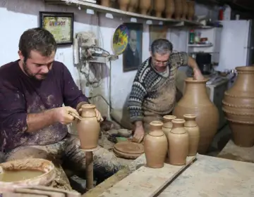 Handcrafted clay pottery display in Avanos
