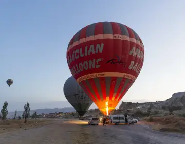Sunset rock formations with hot air balloon