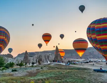 Colorful hot air balloons floating over Cappadocia