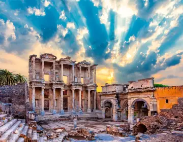 Sunrise cloudscape over ancient city Celsus Library Ephesus