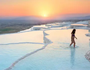 Sunset beauty of reflective blue pools in Pamukkale