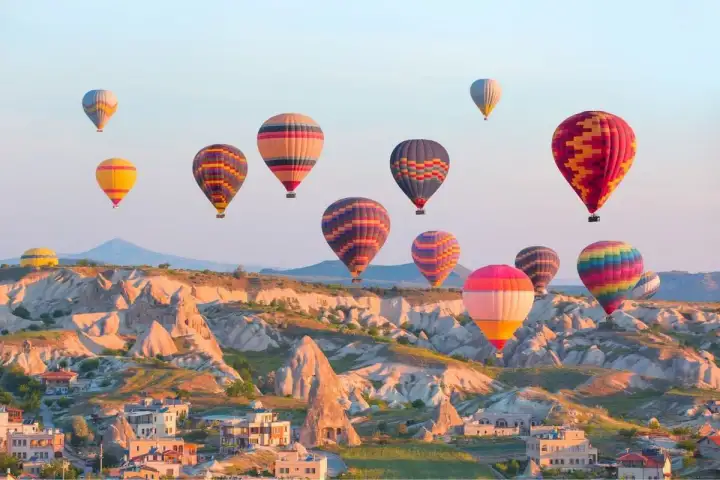 Aerial scenery of sunset balloons in Cappadocia