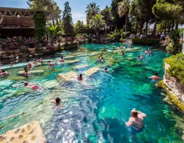 People swimming in thermal spring of Cleopatra Antique Pool Pamukkale