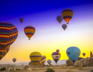 Colorful sunrise sky with Cappadocia balloons